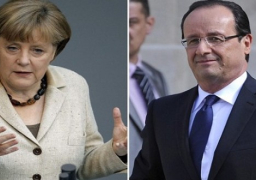 هولاند وميركل يهددان روسيا بعواقب حال فشل انتخابات الرئاسة بأوكرانيا