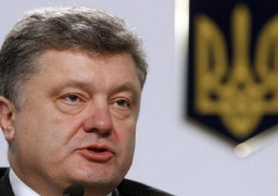 بوروشينكو يحث ميركل على مساعدته في حل الأزمة بشرق البلاد