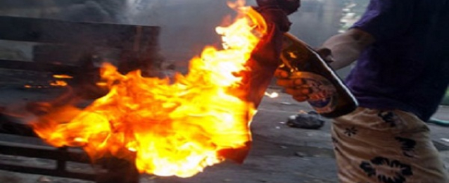عشرات الإخوان يشعلون النيران في نقطة مرور بشارع فيصل بالجيزة